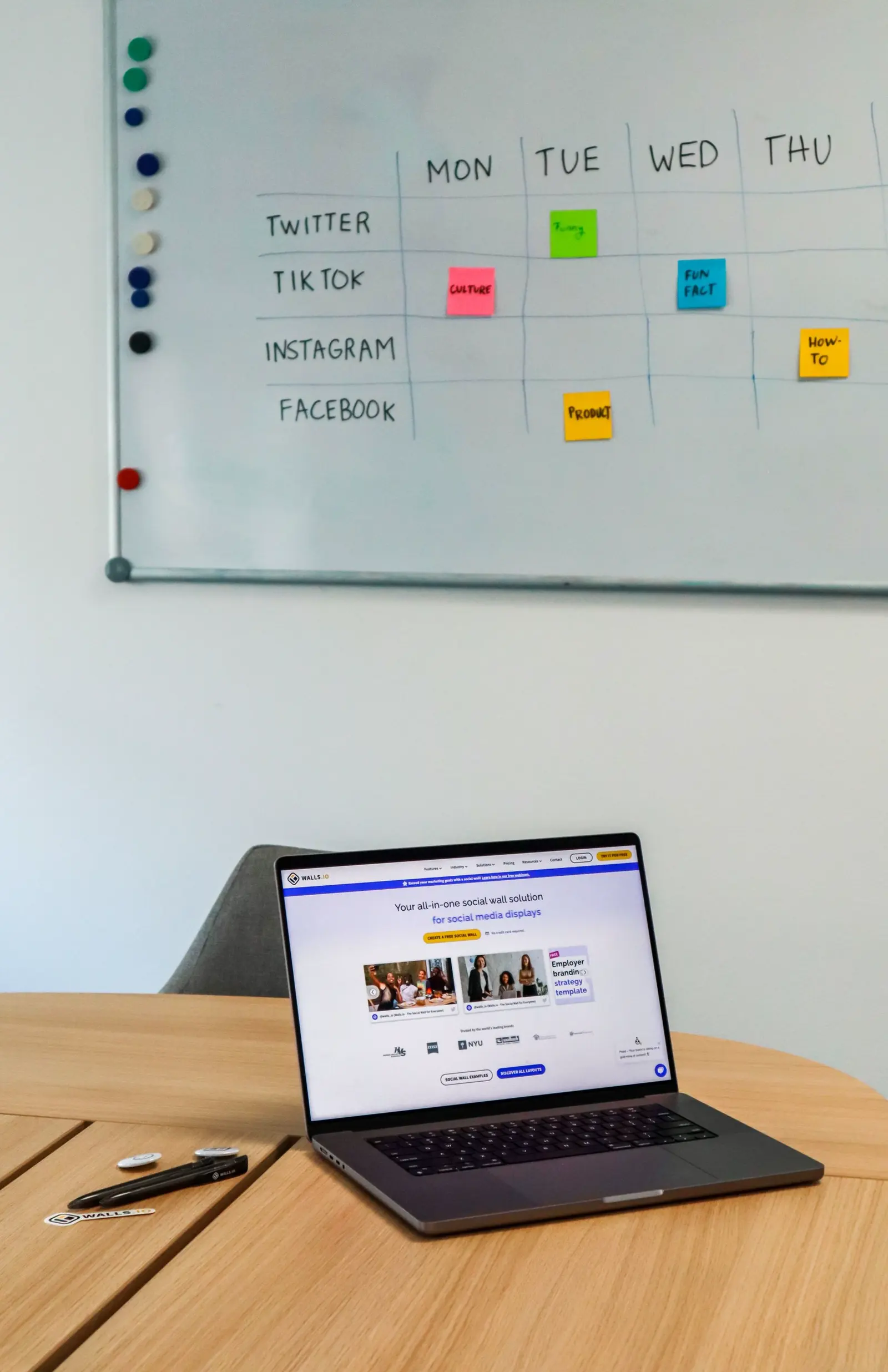 Laptop and whiteboard used for MVP roadmap planning